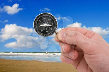 Royalty Free Photo of a Person Holding a Compass