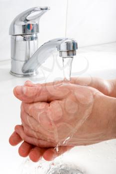 Royalty Free Photo of a Person Washing Their Hands