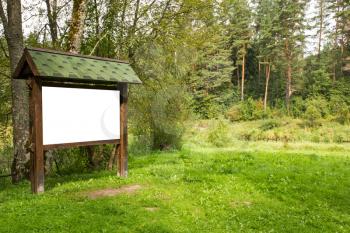 Blank wooden billboard with copy space in  the forest 