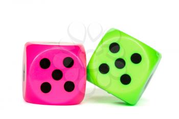Pink and green dices over a  white background