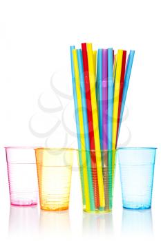 Plastic colored glasses and bunch of colorful straws