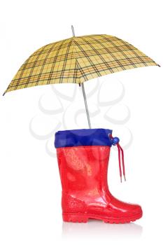 Rain boot and a yellow umbrella on a white background.