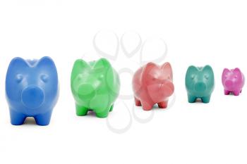 Colourful Piggy banks in a row over a white background