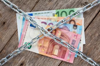 European currency with chain , concept money tied up