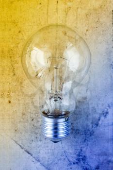Tungsten light bulb with a colorful background