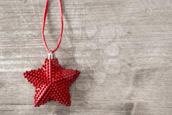 Christmas star on a wooden background with copy-space