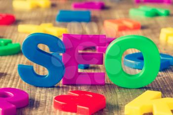 SEO word made of colorful magnets. Search engine optimization