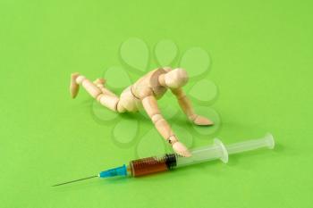 Addict man grab drug syringe of heroin. Narcotic addiction concept. 