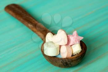 Wooden spoon with assorted little candies