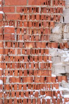 Outdoor texture - demaged red brick wall background