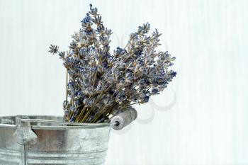   Close up view of metal bucket with dried lavender 