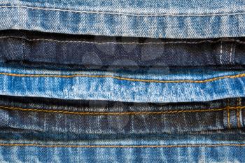 Various blue jeans close-up. Macro of various jeans seam