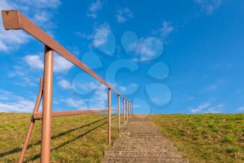 Concrete staircase against blue sky. Development motivation career growth concept