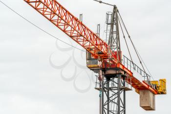 Part of construction tower crane arm against rainy sky. Construction tower crane against the sky. 