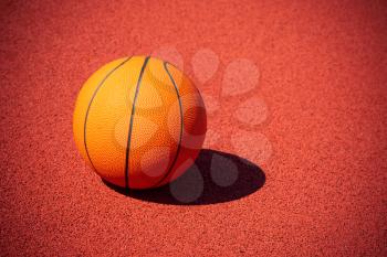 Basketball ball in the outdoors court, copy-space