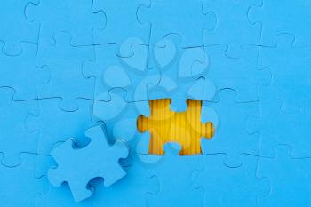 Jigsaw puzzle, business concept of solution. Blue jigsaw puzzle with missed piece.
