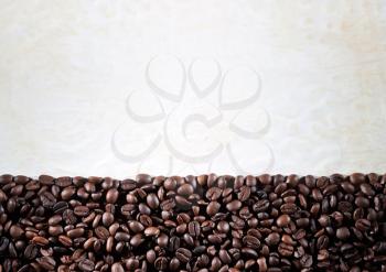 Coffee beans on paper background
