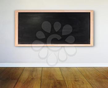Wall with chalkboard and wooden parquet