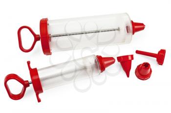 Two different sizes of confectionery syringe with replaceable nozzles isolated on white background