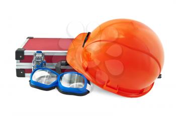 The orange helmet, a red suitcase for tools, safety glasses with black blue isolated on white background