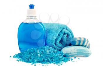 Blue liquid soap in a bottle, solid blue striped and mottled soap, bath salt, blue towel isolated on white background