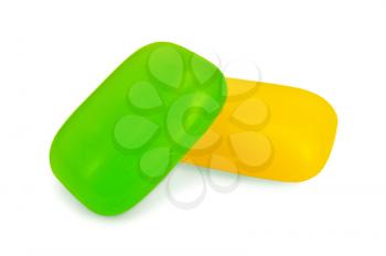 Two pieces of soap yellow and green isolated on a white background