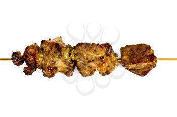 Fried meat and onions on a wooden skewer isolated on white background
