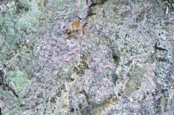 Texture of natural gray, pink and green granite stone
