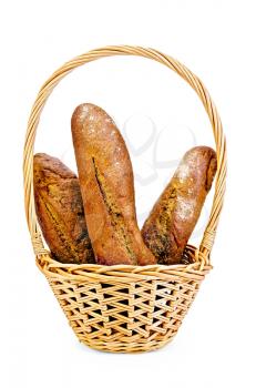 Three rye baguette in a wicker basket isolated on white background