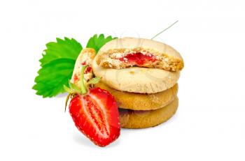 Stack of cookies filled with jam, berries and green leaves of strawberries isolated on white background