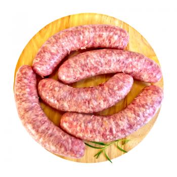 Pork sausage with rosemary on a circular wooden board isolated on white background