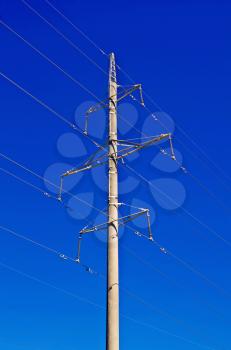 Pylon transmission tower against the blue sky