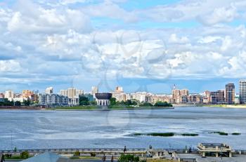 KAZAN, RUSSIA - JULY 26, 2014: Embankment of the river in Kazan. View from the Kazan Kremlin on the city and the building of the family center. Tatarstan Republic.