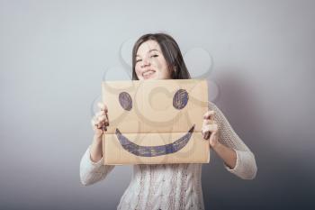 girl holding a happy smiley