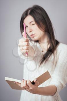 girl with pencil and notepad