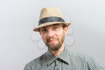 Portrait of handsome bearded man in hat standing