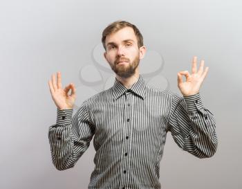 young man shows sign and symbol ok