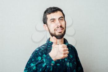 a man of Caucasian appearance showing thumbs up