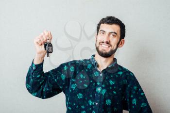 young man with the keys of his new car