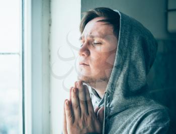 Despair man praying God