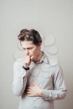 Young sick man coughing