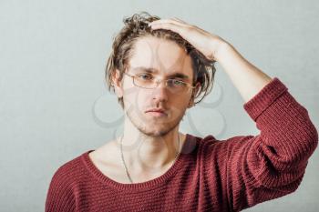 guy with glasses can't remembers holding his head