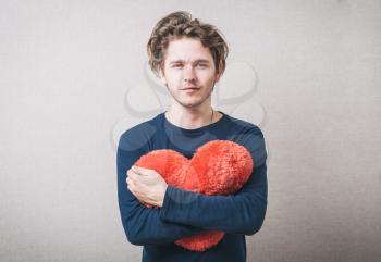 Love and valentines day man holding heart