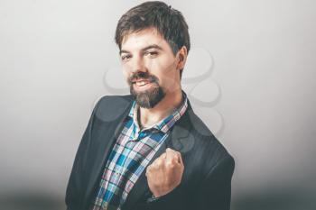 bearded businessman happy with fist