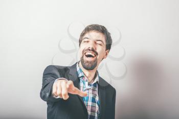 bearded businessman points finger and taunts