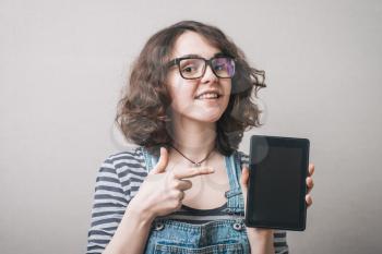 young woman shows tablet
