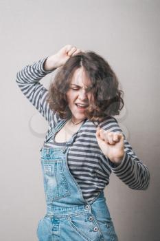 girl dancing on a gray background