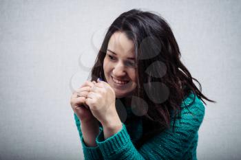 beautiful woman clasped hands in front of him