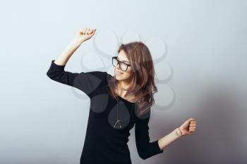 young woman dancing on white background