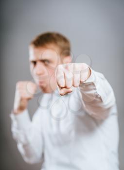 Angry man throwing a punch